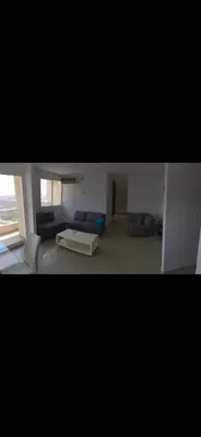 a large living room with a couch and a table at Apartamento entero en Miramar, Barranquilla Norte in Barranquilla