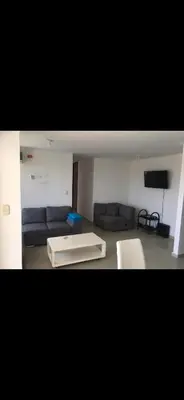 a living room with a couch and a table at Apartamento entero en Miramar, Barranquilla Norte in Barranquilla