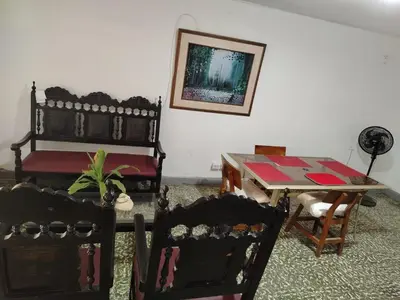 a room with a table and chairs and a table and a table and chairs at Cartagena, full house in Cartagena de Indias