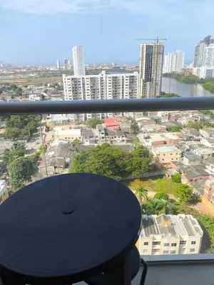 a view of a city from a balcony with a table at Cartagena near the beach in Cartagena de Indias
