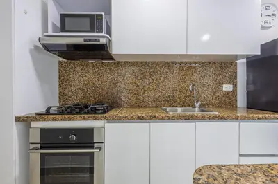 a kitchen with a sink and a microwave at Bocagrande Summer Beach - Primera linea de mar in Cartagena de Indias