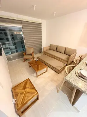 a living room with a couch and a table at Charming Apartment Close to the Beach in Cartagena de Indias