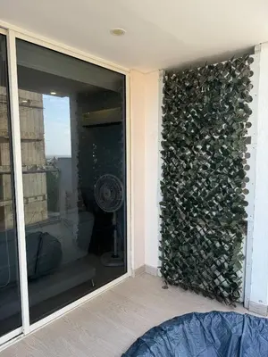 a room with a wall full of fire wood at Cartagena Cielo Mar Apartment Steps from the Beach in Cartagena de Indias