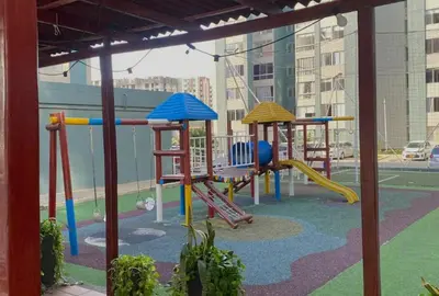 a playground with a slide and a swing set at Apartamento cómodo, ubicación excelente in Barranquilla