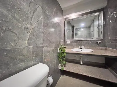 a bathroom with a sink and a mirror at Apartamento con vista al mar - Riviera Mulata Beach in Cartagena de Indias