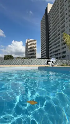 a swimming pool in front of some tall buildings at Horizonte Infinito - Calidez frente al mar Santa Marta in Santa Marta