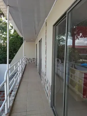 a hallway of a house with a glass door at Apartamento amoblado in Barranquilla