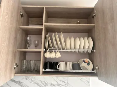 a cupboard with dishes and plates on it at Beach 1203 Lotus Cartagena in Cartagena de Indias