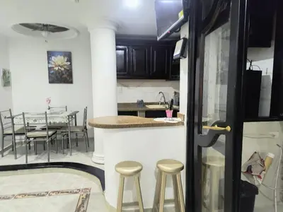 a kitchen and dining room with a table and chairs at Capri apartamento in Guayepo