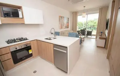 a kitchen with a sink and a stove top oven at Exclusivo Apartamento en Cartagena, Baia Kristal, Zona Kabo in Cartagena de Indias