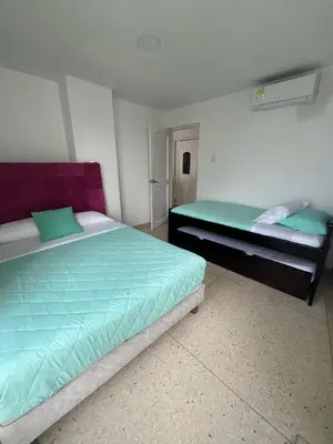 a bedroom with two beds in a room at Apto en Edificio Centauro Ideal para tu estadia in Cartagena de Indias
