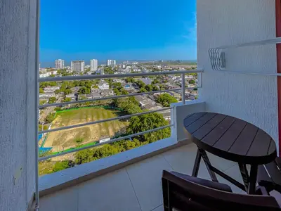 a balcony with a table and chairs and a view at View 17, Modern, 5 min from Rafael Nuñez Airport in Cartagena de Indias