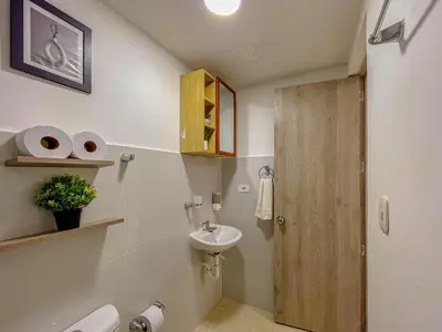 a small bathroom with a sink and a toilet at View 17, Modern, 5 min from Rafael Nuñez Airport in Cartagena de Indias