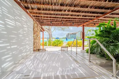 an open patio with a view of the ocean at kristal lagoon view apartement in Cartagena de Indias