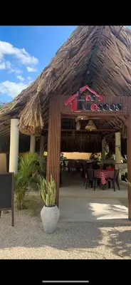 a pavilion with a restaurant with tables and chairs at Cabaña la Industrial in Coveñas