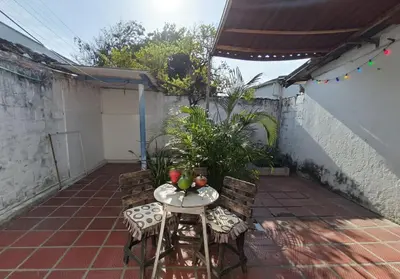 a small table and chairs on a patio at Habitacion privada y central in Barranquilla