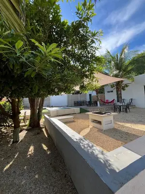 a park with a bench and a table and trees at House Las Palmas villa privada in Puerto Colombia
