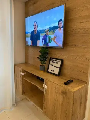 a flat screen tv sitting on a wooden wall at Premium stay in a central area with parking in Cartagena de Indias