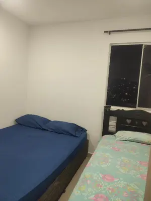 a small bedroom with a bed and a window at Sagitario hospedaje in Cartagena de Indias