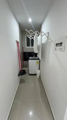 a small room with a white hallway with a small refrigerator at Lindo & Cómodo Apartamento en La boquilla in Cartagena de Indias