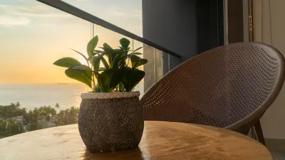 a table with a vase with a plant on it at Loft Privado , Sunset y armonia in Santa Marta