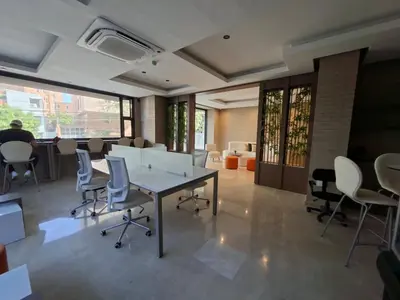 an office with a table and chairs in a room at Edificio Shanty- Easy Rents Sas in Barranquilla