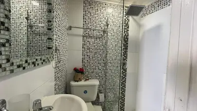 a bathroom with a toilet and a sink and a shower at Apartamento Boutique Cartagena in Cartagena de Indias