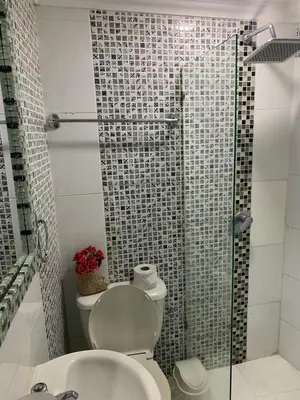 a bathroom with a toilet and a glass shower at Apartamento Boutique Cartagena in Cartagena de Indias