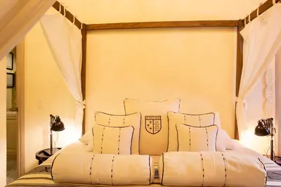 a bedroom with a bed with two pillows at Casa de Alba Hotel Boutique in Cartagena de Indias