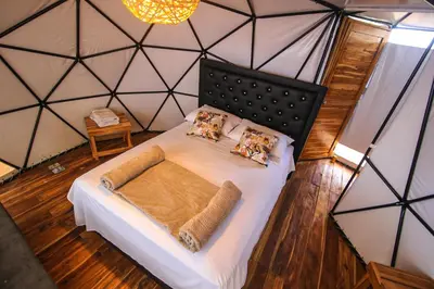 a bedroom with a large bed in a tent at La Cabaña Glamping Geronimo in Playa Blanca