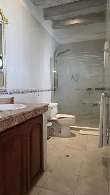 a bathroom with a toilet and a sink and a shower at Hotel Casa la Tablada in Cartagena de Indias