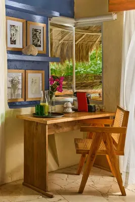a wooden desk in a room with a window at Blue Apple Beach in Tierra Bomba