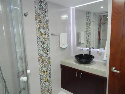 a bathroom with a sink and a shower at Apartment Lux Bocagrande in Cartagena de Indias
