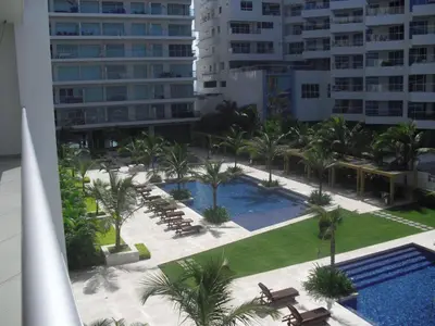 an aerial view of a resort with a pool and palm trees at Apartamento Morros Epic Cartagena in Cartagena de Indias