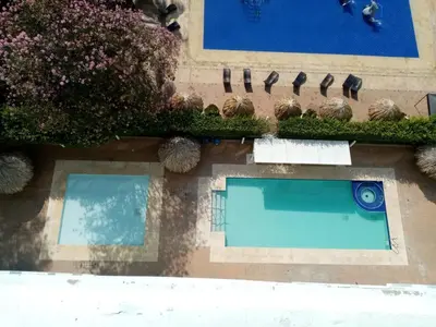 an overhead view of a swimming pool on a building at Costa Azul Suites 802 in Santa Marta