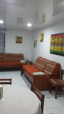 a living room with two beds and a table at Edificio Nuevo Conquistador in Cartagena de Indias