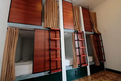 a row of bunk beds in a room at República Hostel Cartagena in Cartagena de Indias