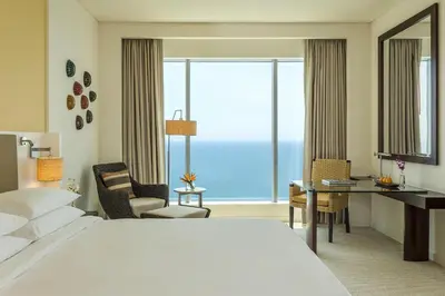 a hotel room with a large bed and a large window at Hyatt Regency Cartagena in Cartagena de Indias