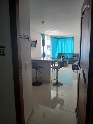 a living room with a table and chairs in it at Cartagena Linda 204 in Cartagena de Indias