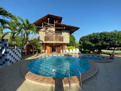 a resort with a swimming pool and a house at Cabana Dubai Resorts in Santa Veronica