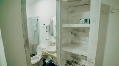 a small bathroom with a toilet and a sink at Green Coveñas by Bernalo Hotels in Coveñas