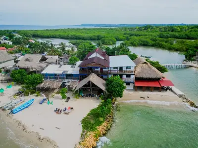 an aerial view of a resort on a beach at Hostel Blue Sea Rincon del Mar in Rincón