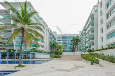 a view of the exterior of a large apartment building at Apartamento Frente a la Playa Morros 922 in Cartagena de Indias