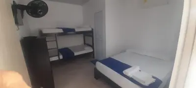 a small room with two bunk beds in it at Hotel Don Toño Tolú in Tolú