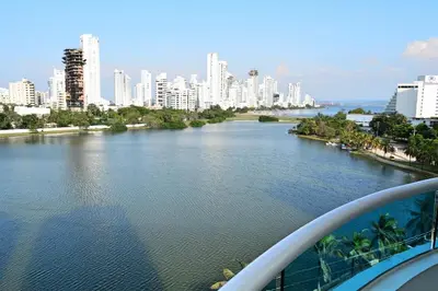 a view of a river with a city in the background at Torres del Lago Apartamentos in Cartagena de Indias