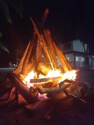 a large fire pit on the beach at night at Hotel Mar del Viento in San Bernardo del Viento