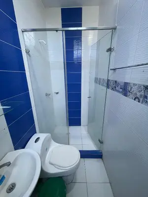 a bathroom with a shower and a toilet and a sink at Cabanas Villa Antonella Covenas in Coveñas