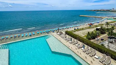 an overhead view of a swimming pool next to the beach at Namaste Alojamientos Luxury Cartagena in Cartagena de Indias