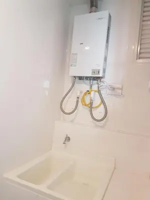 a white bathroom with a sink and a box on the wall at Morros City - Frente al mar in Cartagena de Indias