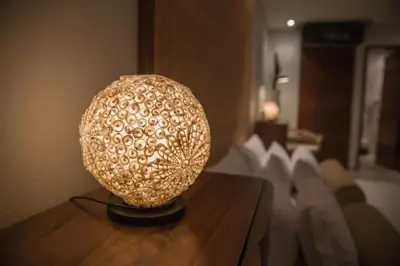 a lamp sitting on top of a wooden table at Casa Claver Loft Boutique Hotel in Cartagena de Indias
